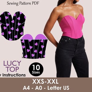 Könnte beinhalten: Ein pinkfarbenes trägerloses Top und ein schwarzes Korsett-Schnittmuster mit lila Herzen. Das Muster enthält einfache Anweisungen und ist in 10 Größen von XXS bis XXL erhältlich. Der Text "LUCY TOP" ist ebenfalls sichtbar.