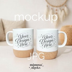 May include: Two white ceramic mugs with a cork base, each featuring the text "Your Design Here" in a script font. The mugs are displayed on a light surface, with the word "mockup" above them.