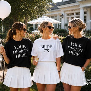 CC1717 black and white bachelorette group mockup — 3 models in garden estate, bride in white tee, bridesmaids in black — Bella Canvas 3001 compatible, instant download