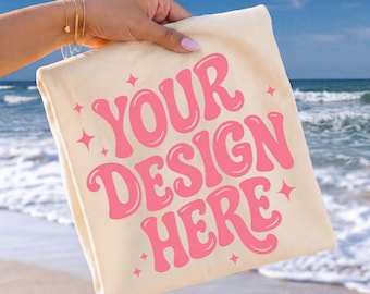 Comfort Colors® 1717 Ivory Mockup Hand Held Folded Tee Coastal Beach Scene POD Listing Image