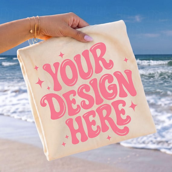 Comfort Colors® 1717 Ivory Mockup Hand Held Folded Tee Coastal Beach Scene POD Listing Image