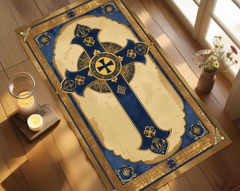 May include: A rectangular rug featuring a large, ornate cross design. The cross is navy blue with gold accents, set against a cream-colored background. The rug has a gold border with decorative patterns, suitable for home decor.