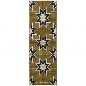 May include: Olive green runner rug with a repeating star pattern in navy blue and cream. The stars are outlined in white. The rug has a rectangular shape and is likely made of woven material. The text "Carpet Centre" is visible in the image.
