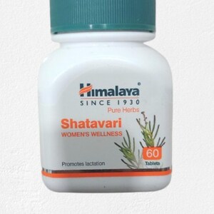 May include: A white bottle with a teal cap, labeled "Himalaya Shatavari WOMEN'S WELLNESS." The bottle contains 60 tablets and promotes lactation. The label includes the text "Pure Herbs" and the Himalaya logo.