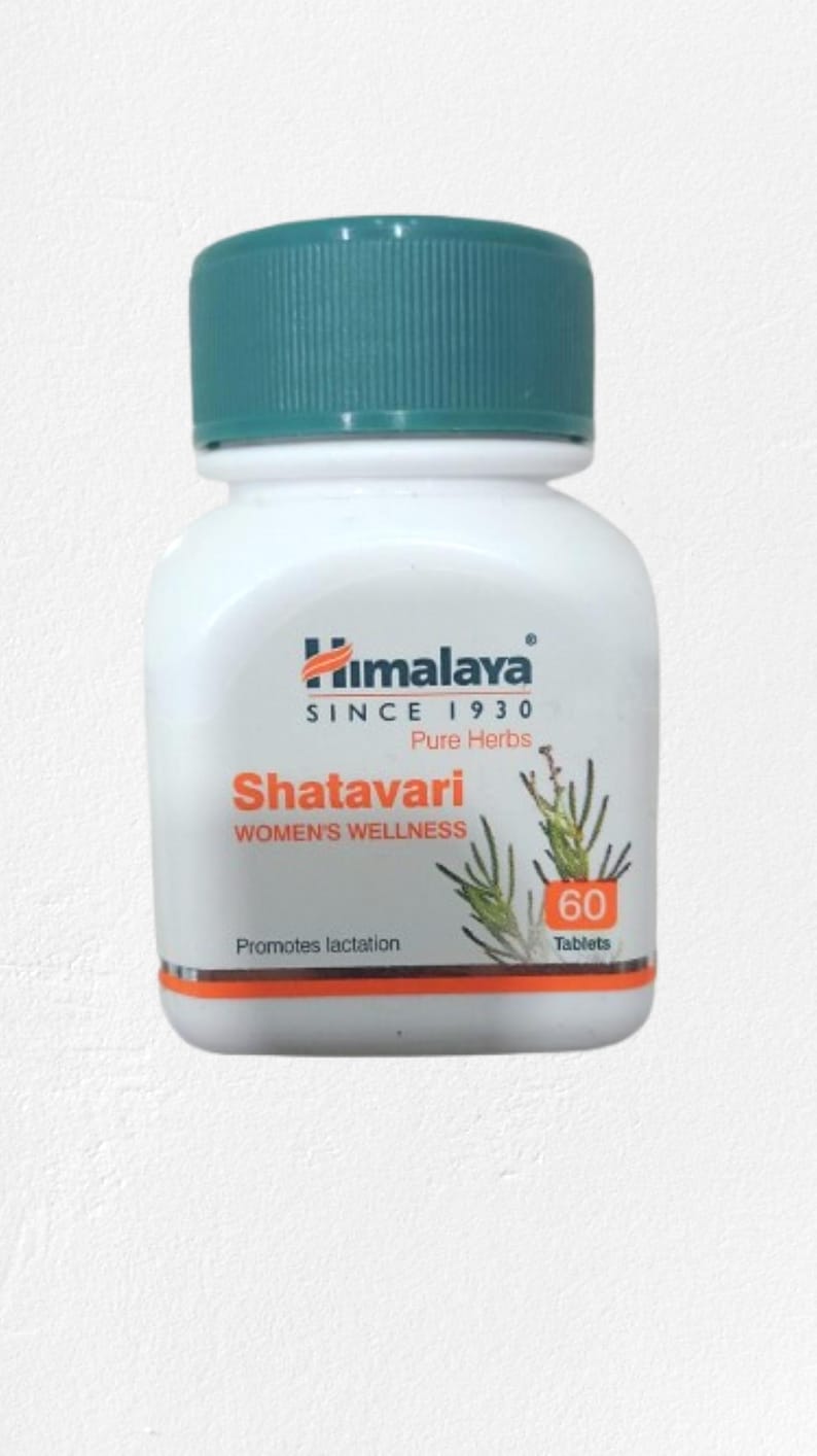 May include: A white bottle with a teal cap, labeled "Himalaya Shatavari WOMEN'S WELLNESS." The bottle contains 60 tablets and promotes lactation. The label includes the text "Pure Herbs" and the Himalaya logo.