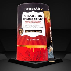 May include: A cylindrical container of BetterAlt Shilajit Pro Energy Sticks. The label features text including "Daily Energy Boost" and "Improved Stamina." A single stick is visible next to the container. The container is red and black with gold accents.