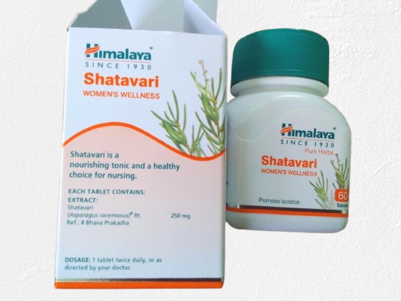 May include: A white bottle and box of Himalaya Shatavari tablets. The box features the text "Shatavari WOMEN'S WELLNESS" and "Since 1930". The bottle has a green cap and contains 60 tablets. The box states that Shatavari is a nourishing tonic.