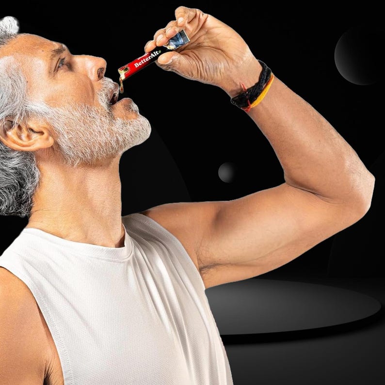 May include: A man in a white tank top is taking a supplement from a small packet labeled "BetterLife." The packet is red and blue. The background is black with a minimalist design.