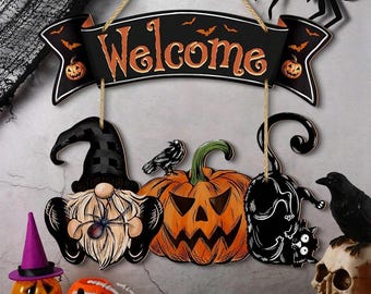 May include: A Halloween-themed wooden sign with the word "Welcome" in orange lettering. The sign features a gnome, a jack-o'-lantern, and a black cat. Additional decorations include a skull, spiders, and a small pumpkin with a witch hat.