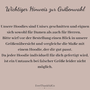 May include: A beige graphic with black text. The text reads "Wichtiger Hinweis zur Gr&ouml;&szlig;enwahl" and further details about hoodie sizing, including unisex fit and the importance of checking size charts before ordering. The EverThankfulCo logo is at the bottom.