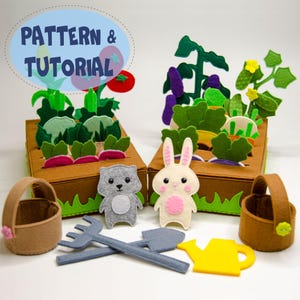 May include: A felt garden playset with two brown boxes filled with felt vegetables. Includes a gray cat, a white bunny, two brown baskets, and felt gardening tools. The text "PATTERN & TUTORIAL" is in a blue oval.