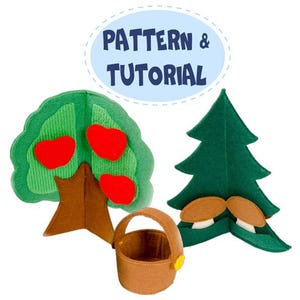 May include: A felt craft set featuring a tree with red apples, a pine tree with mushrooms, and a small basket. The text "PATTERN & TUTORIAL" is in a blue oval above the objects. The objects are made of green, brown, and red felt.