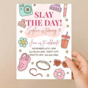 May include: A party invitation with a light beige background, featuring illustrations of a camera, hair accessories, a drink, a flower, a shoe, a bracelet, sunglasses, and a scrunchie. The text reads "SLAY THE DAY!" and "Sophia is turning 10".