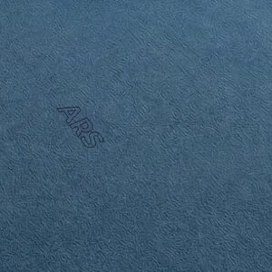 May include: Close-up of a textured, blue fabric with the letters "ARS" subtly embroidered across the surface. The fabric has a soft, matte appearance and a consistent color throughout.
