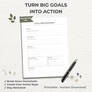 May include: A white printable goal breakdown worksheet with sections for big goals, milestones, and action steps. A black pen rests on the right side. The text reads "Turn Big Goals Into Action" and "Goal Setting Tool."