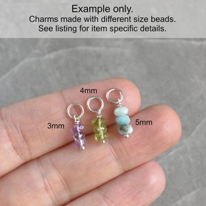 K&ouml;nnte beinhalten: Drei Anh&auml;nger mit verschiedenen Perlengr&ouml;&szlig;en. Die Anh&auml;nger sind aus Amethyst-, Peridot- und Aquamarinperlen gefertigt. Die Anh&auml;nger sind 3 mm, 4 mm und 5 mm gro&szlig;.