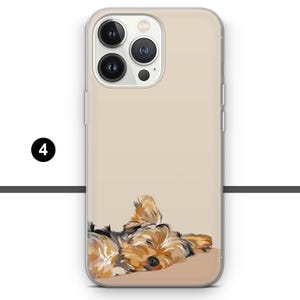 May include: A phone case featuring a digital illustration of a sleeping Yorkshire Terrier. The case has a clear border and a beige background. The dog is depicted in shades of brown, tan, and black.