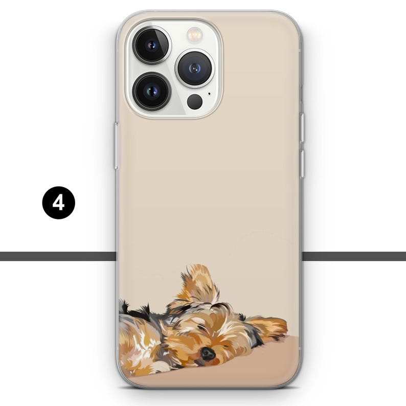 May include: A phone case featuring a digital illustration of a sleeping Yorkshire Terrier. The case has a clear border and a beige background. The dog is depicted in shades of brown, tan, and black.