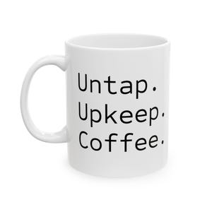 May include: White ceramic coffee mug with the words "Untap. Upkeep. Coffee." printed in black. The mug has a curved handle and a cylindrical shape, perfect for enjoying your favorite beverage.