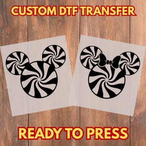 May include: Two DTF transfer sheets featuring a black and white Mickey Mouse head design made of peppermint candies. One design has a bow. The text "CUSTOM DTF TRANSFER" and "READY TO PRESS" are in yellow.