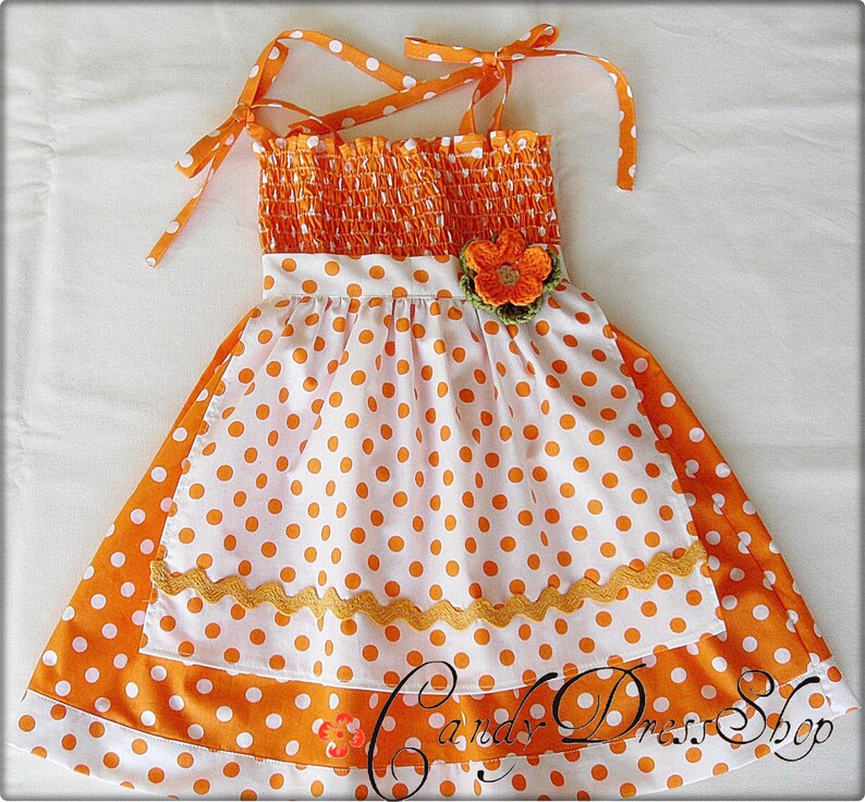 orange and white polka dot dress