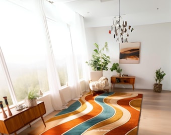 May include: A colorful area rug with a wavy design in shades of orange, teal, yellow, and cream. The rug is placed in a bright, modern living room with a mid-century modern style.