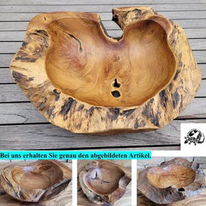 Könnte beinhalten: Eine Schale aus Naturholz mit Baumkante, die ein hellbraunes Inneres mit sichtbarer Maserung und eine dunkle, strukturierte Rinde an der Außenseite aufweist. Die Schale hat eine unregelmäßige, organische Form mit einem kleinen Loch im Becken.
