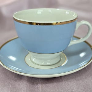 Royal Doulton Teacup and saucer designed by Bruce Oldfield - Pale blue with white and gold trim