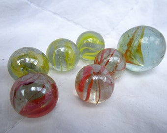 Set of 7 Onion Skin Swirl Marbles in Green and Orange Patterned Clear Glass
