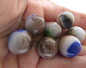 Seven Blue, Brown, White and Green Splash Marbles Standard Size