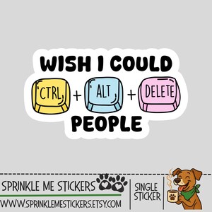 May include: A white sticker with the text "WISH I COULD CTRL + ALT + DELETE PEOPLE." The design features yellow, blue, and pink keyboard keys. A cartoon dog with a green bandana and a coffee cup is in the lower right corner.