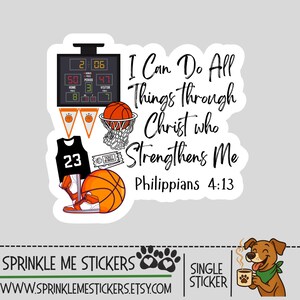 May include: A sticker featuring basketball-themed graphics, including a scoreboard, basketball, jersey, and a hoop. The text reads "I Can Do All Things Through Christ Who Strengthens Me, Philippians 4:13."