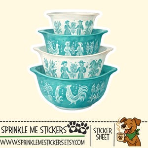 May include: A stack of four teal and white mixing bowls with a vintage design. The bowls feature a rooster, wheat, and figures in traditional clothing. The bowls are nested together, showcasing their varying sizes and decorative patterns.