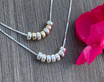 Sterling Silver Seven Rings Necklace: Minimalist Luck Charm