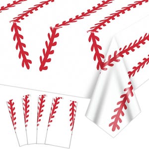 May include: White tablecloth and matching coasters with a red baseball stitch design. The tablecloth is folded, displaying the repeating pattern. The coasters are arranged in a row, also featuring the baseball stitch.