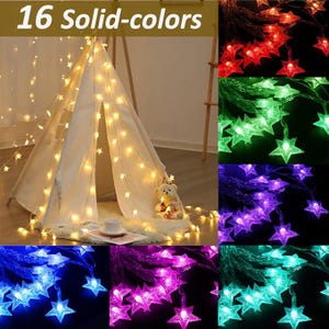 May include: A white teepee tent decorated with star-shaped string lights. The image shows various colors of star lights, including red, green, purple, blue, pink, and teal. The text "16 Solid-colors" is at the top.