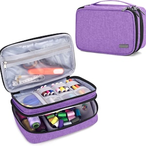 May include: A purple sewing kit with multiple compartments, zippers, and a handle. The open kit reveals spools of thread, needles, and other sewing supplies. The closed kit is rectangular and has a zipper closure.