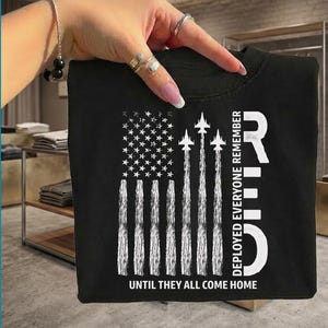 May include: A set of three ceramic vases in varying heights and shapes. The vases are glazed in a matte white finish, offering a minimalist aesthetic. The tallest vase is approximately 10 inches high.