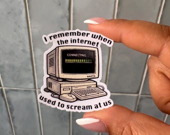 May include: A die-cut sticker featuring a vintage beige computer monitor, keyboard, and mouse. The screen displays a black box with the text 'CONNECTING...' and a green loading bar. The text 'I remember when the internet used to scream at us' arches around the computer.