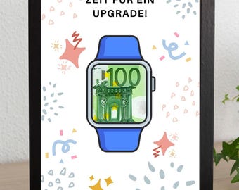 May include: A framed print with a black border features a blue smartwatch design with a 100 Euro bill as the watch face. The German text "ZEIT FÜR EIN UPGRADE!" is at the top, with confetti and stars around the watch.