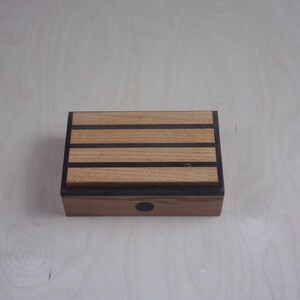 Handcrafted works of Art with a functional flair. Wooden trinket or keepsake box.