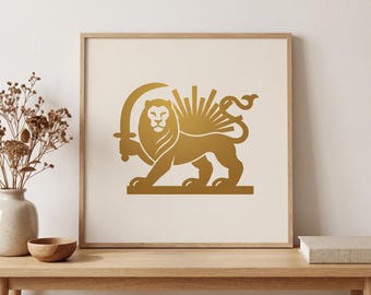 May include: A square framed wall art piece featuring a gold-colored graphic of a lion holding a curved sword, with a sunburst design behind the lion. The artwork is set against a light cream background and enclosed in a light wood frame.