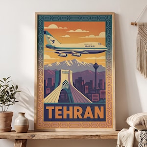 May include: A framed travel poster featuring an Iran Air airplane flying over the Tehran skyline, including the Azadi Tower and Milad Tower against a mountain backdrop. The word TEHRAN is printed in large orange letters at the bottom of the print.