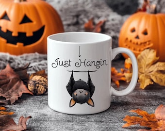 Bat Lovers Mug – “Just Hangin'” Ceramic Coffee Cup – Cute Bat Gift – Spooky Halloween Drinkware – Gothic Animal Lover Mug – 11oz