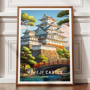 May include: A framed print of Himeji Castle, Japan. The image shows the white castle with multiple tiers, set against a blue sky and surrounded by green trees. The text "HIMEJI CASTLE JAPAN" is at the bottom.