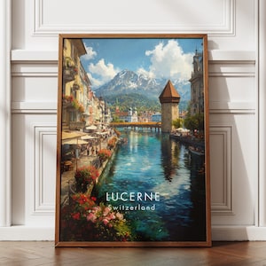 May include: A framed print of Lucerne, Switzerland, featuring a picturesque canal scene. The artwork showcases buildings with red-tiled roofs, a wooden bridge, and a snow-capped mountain in the background. The text "LUCERNE Switzerland" is visible.