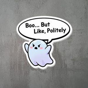 May include: A sticker featuring a cartoon ghost with a grumpy expression and pink cheeks. The ghost is light blue and purple. A speech bubble above the ghost says "Boo... But Like, Politely" in black text.