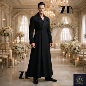 May include: A long, black coat with a double-breasted design. The coat is worn by a person standing in a well-lit room with floral arrangements and chandeliers. The letters "ZB" are visible on the image.