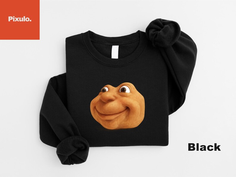 May include: Black crewneck sweatshirt featuring a cartoonish, smiling face in shades of brown and tan. The word "Black" is printed in white on the lower right. The brand "Pixulo." is in the upper left corner.