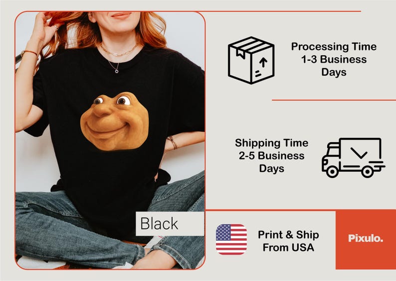 May include: Black t-shirt featuring a smiling, cartoonish face in shades of brown and tan. The word "Black" is visible in a white box. The image also includes shipping and processing information.